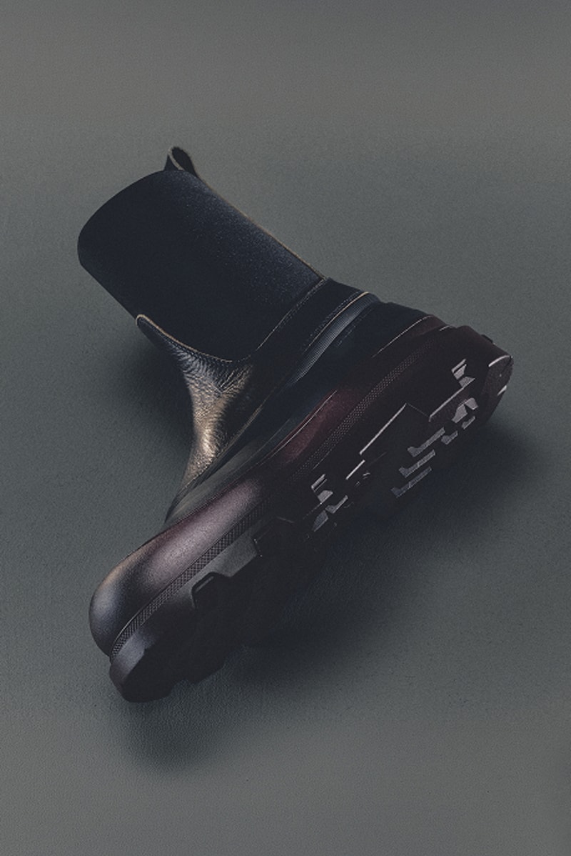 Moncler footwear for women. Black leather ankle boot with burgundy chunky lug sole.
