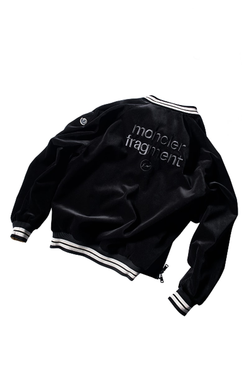 Moncler x Fragment, black jacket with logo on the back and on the sleeve, with black and white striped details.