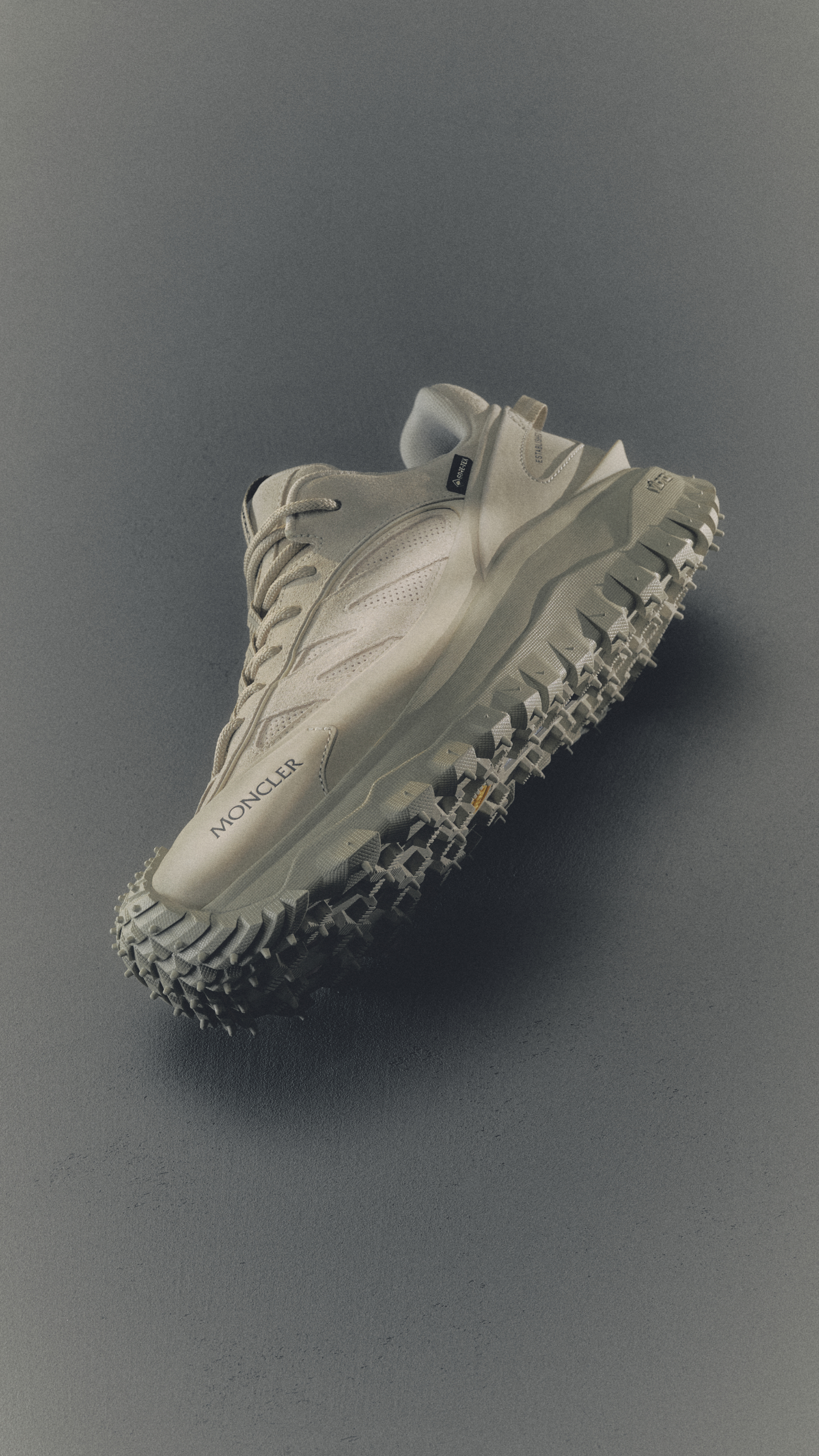 Moncler Men's and Women's Footwear: white sneaker with rubber sole and logo.