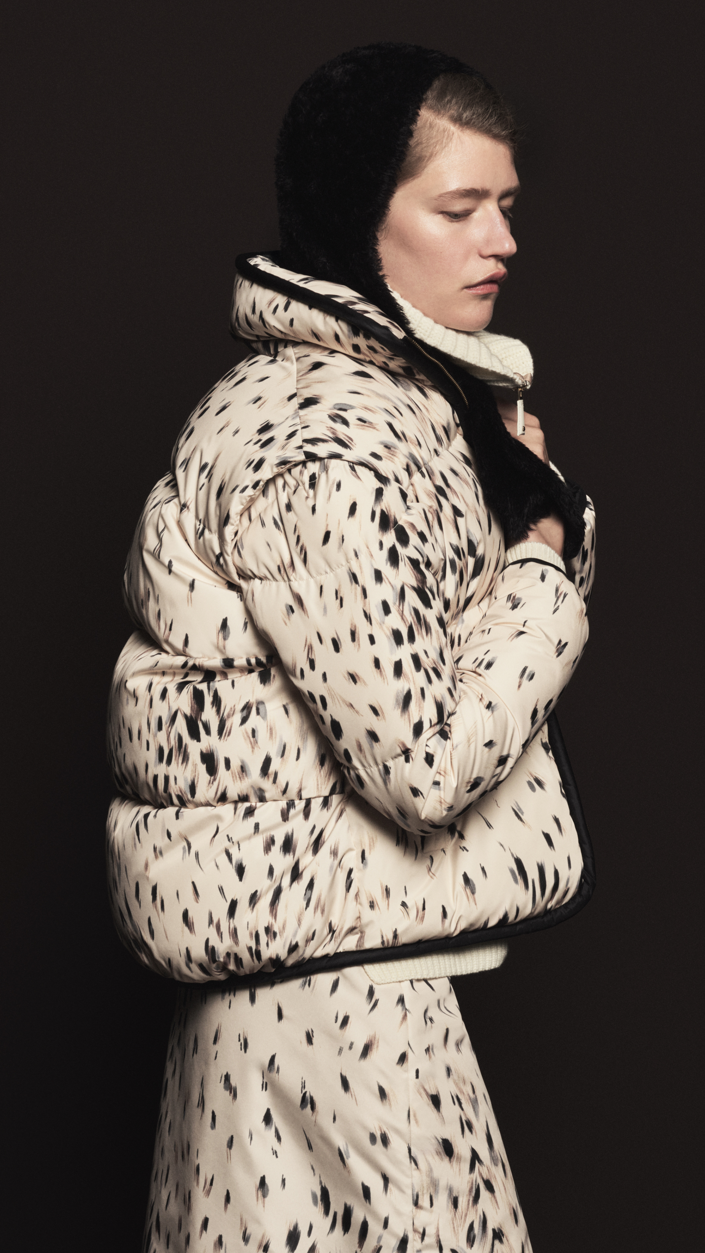 Moncler Fall/Winter 2026, cream down jacket with black spot print, matching trousers and black hood.