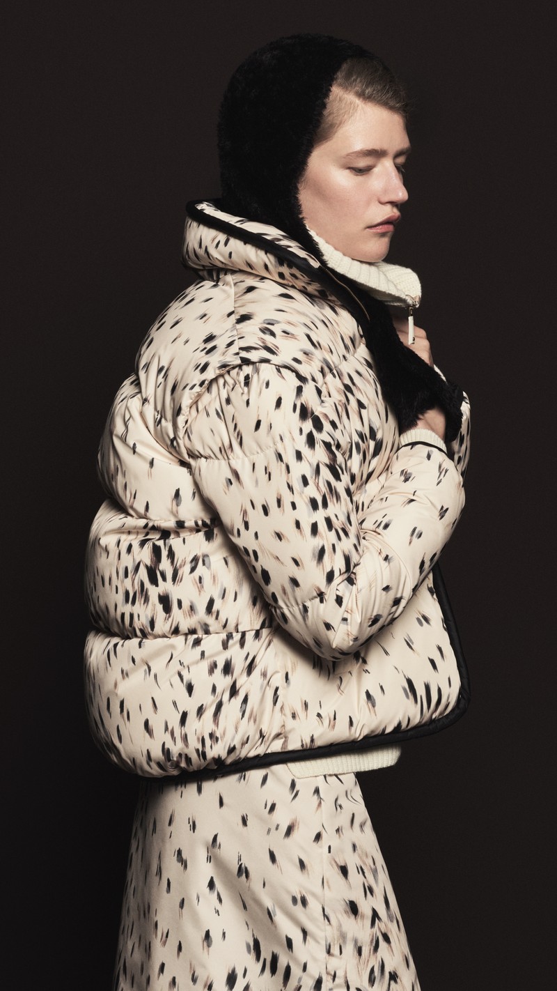 Moncler Fall/Winter 2026, cream down jacket with black spot print, matching trousers and black hood.
