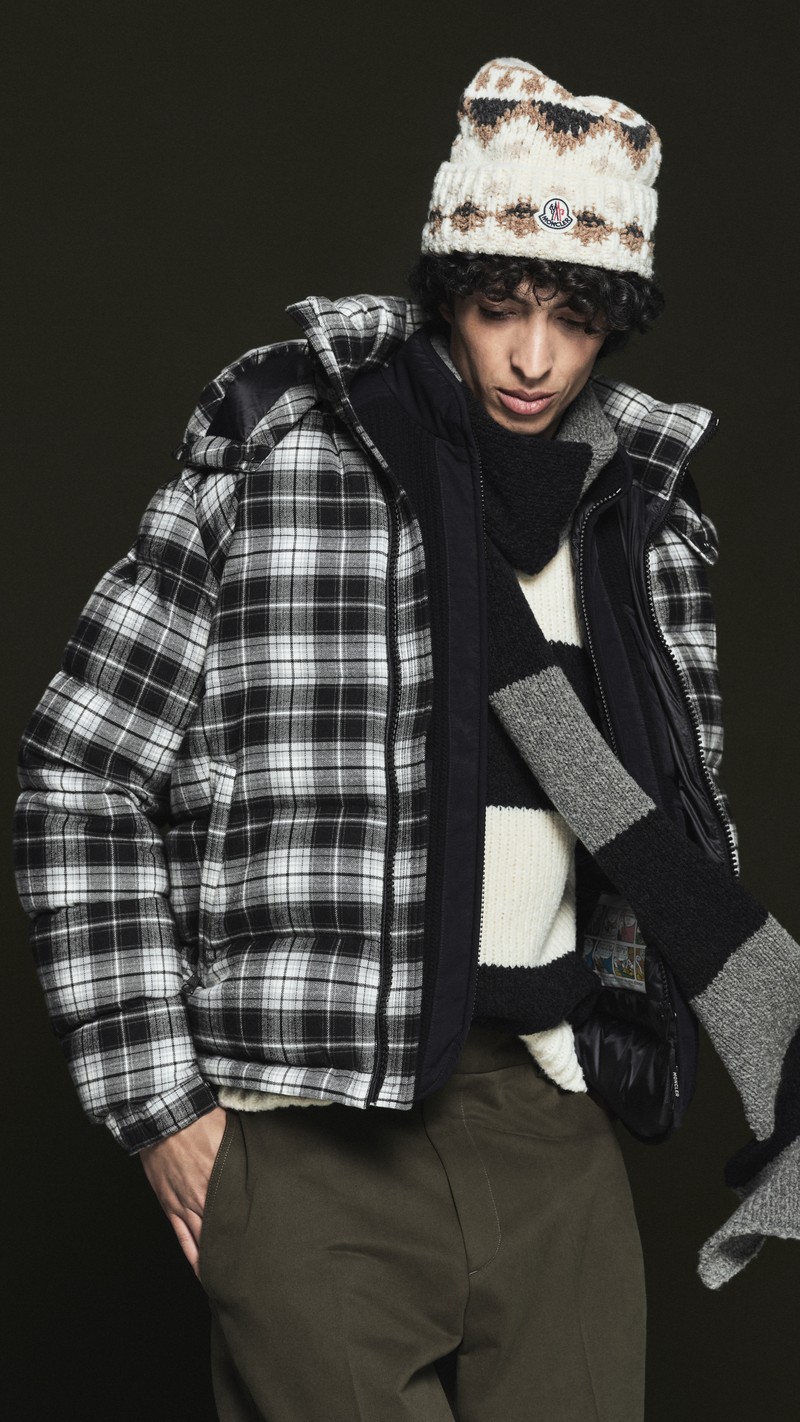 Moncler Pre Fall 2026 for men and women. Wool beanie, checked down jacket, striped scarf and sweater, olive trousers.