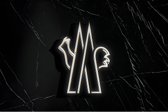 Moncler illuminated neon logo on a black marble background.
