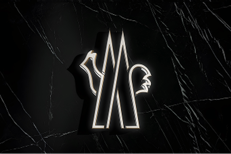 Moncler illuminated neon logo on a black marble background.